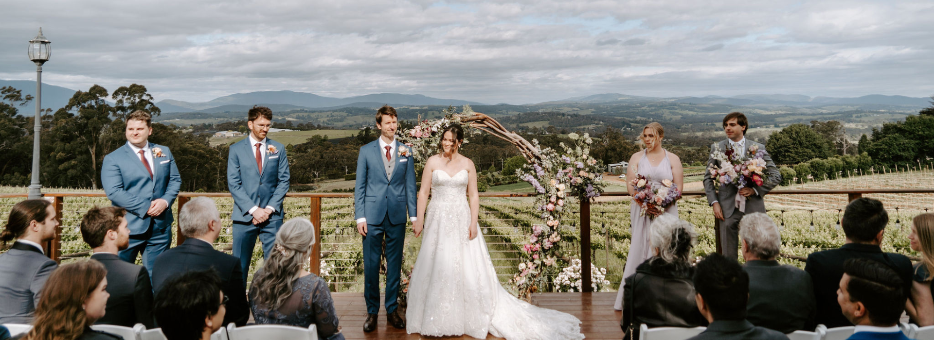 Bride and groom during an outdoor wedding ceremony on the deck at Elmswood Estate with Yarra Valley views